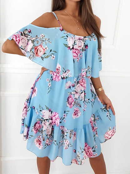 Light Blue - Woman wearing a floral print cold-shoulder tiered dress with a ruffle overlay neckline.