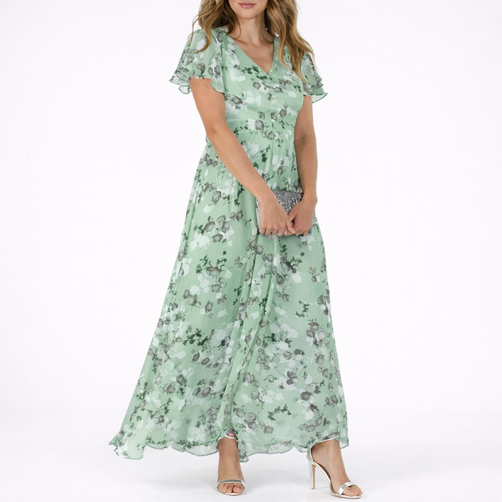 Green - Woman wearing a floral print V-neck midaxi dress with short flutter sleeves and a flowing A-line skirt, styled with a clutch and heels.