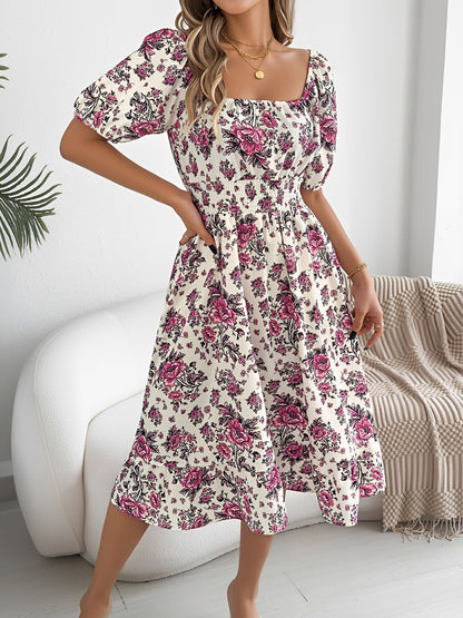 White - Woman wearing a floral print off-the-shoulder midi dress with a smocked waist and short puff sleeves, holding a woven straw bag