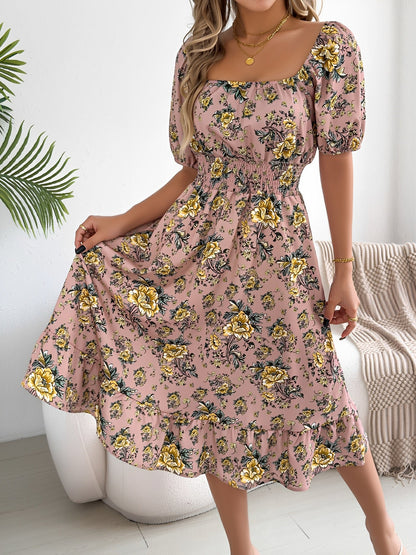 Pink - Woman wearing a floral print off-the-shoulder midi dress with a smocked waist and short puff sleeves, holding a woven straw bag