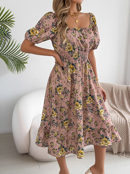 Pink - Woman wearing a floral print off-the-shoulder midi dress with a smocked waist and short puff sleeves, holding a woven straw bag