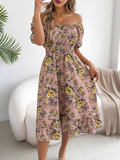 Pink - Woman wearing a floral print off-the-shoulder midi dress with a smocked waist and short puff sleeves, holding a woven straw bag