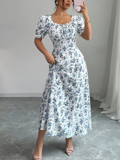 White - Woman wearing a floral print midaxi dress with puff sleeves, a square neckline, and a ruched bust detail.