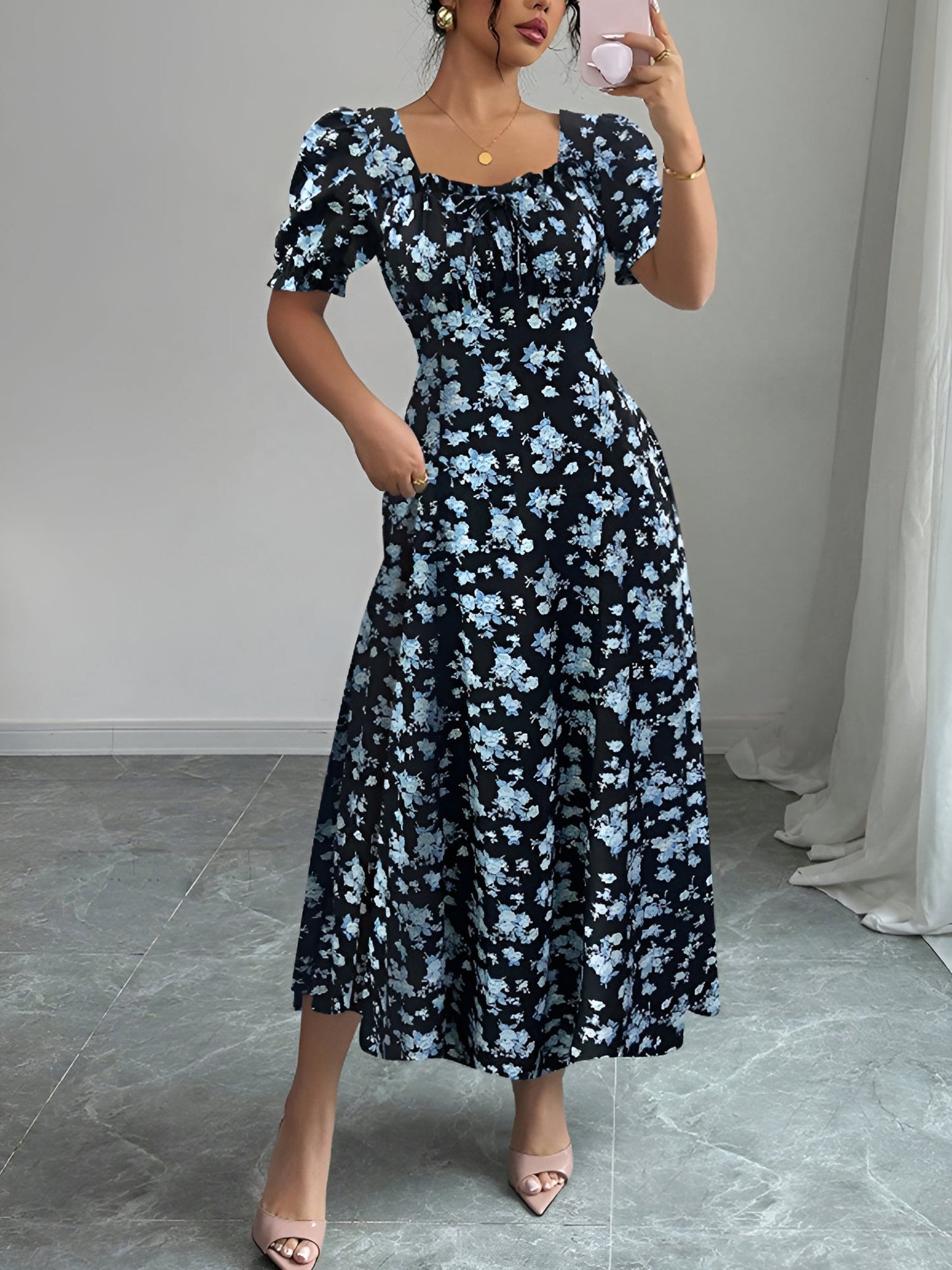 Blue - Woman wearing a floral print midaxi dress with puff sleeves, a square neckline, and a ruched bust detail.