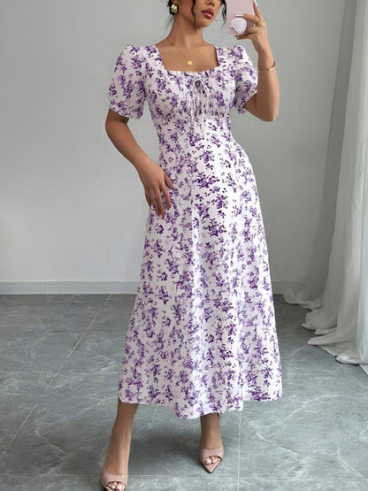 Light Purple - Woman wearing a floral print midaxi dress with puff sleeves, a square neckline, and a ruched bust detail.