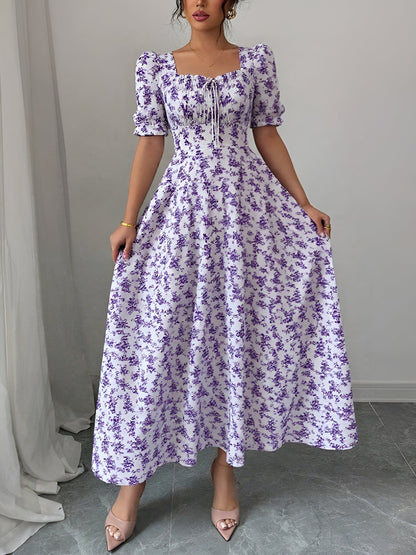 Light Purple - Woman wearing a floral print midaxi dress with puff sleeves, a square neckline, and a ruched bust detail.
