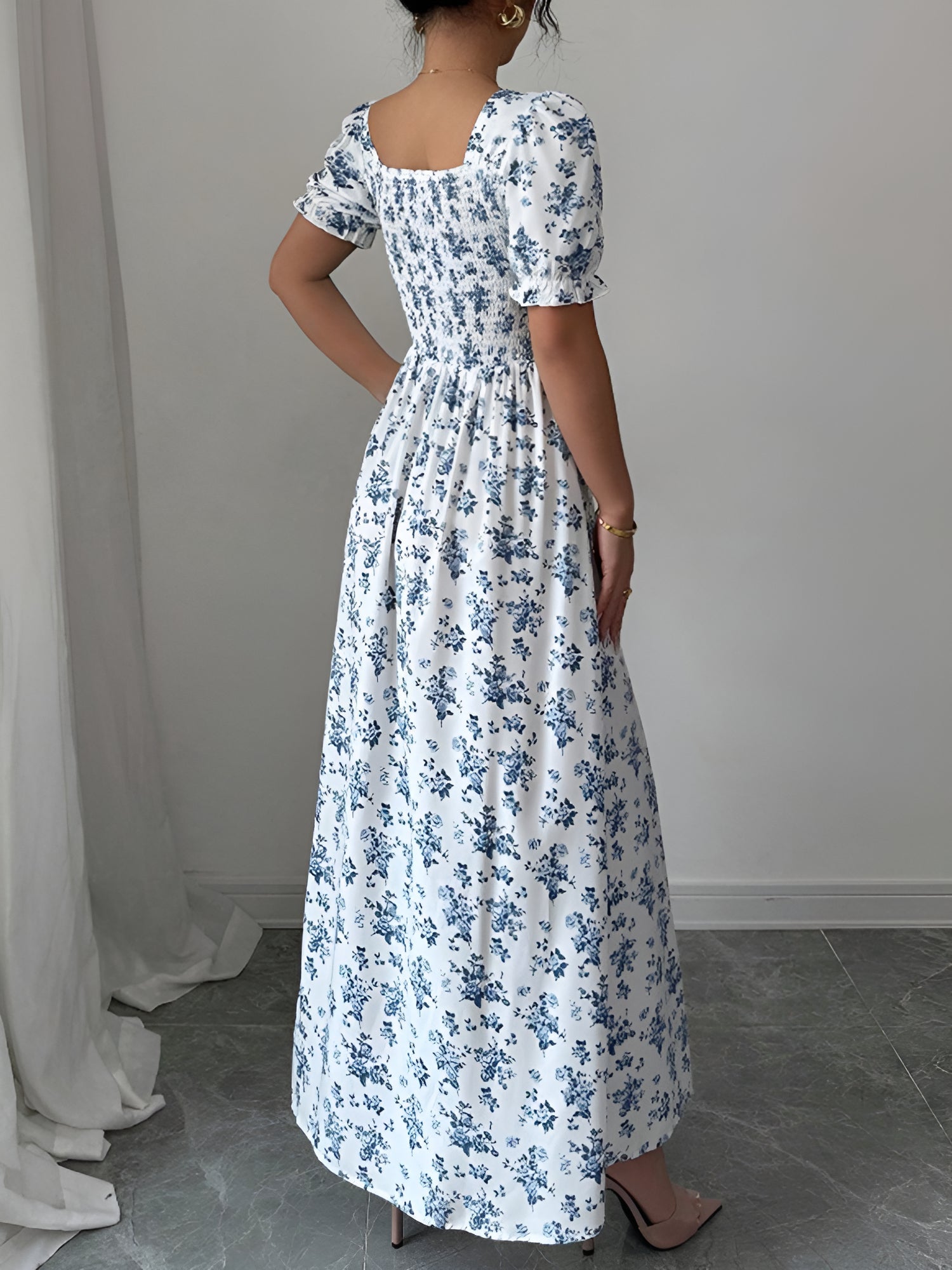 White - Woman wearing a floral print midaxi dress with puff sleeves, a square neckline, and a ruched bust detail.