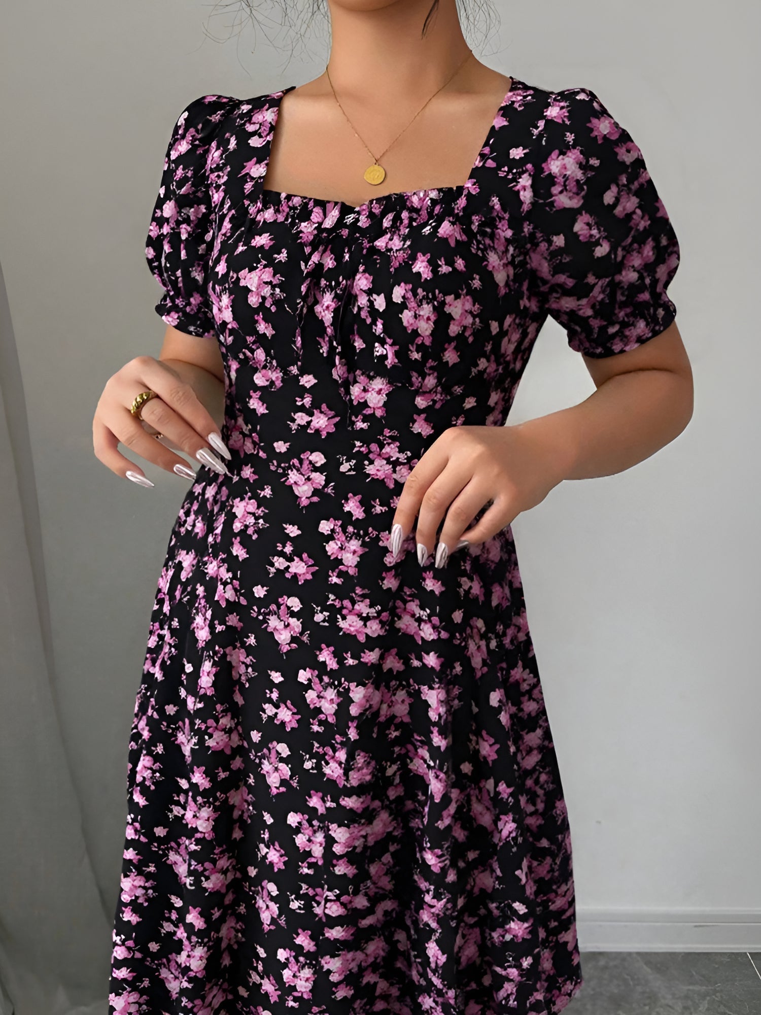 Dark Purple - Woman wearing a floral print midaxi dress with puff sleeves, a square neckline, and a ruched bust detail.