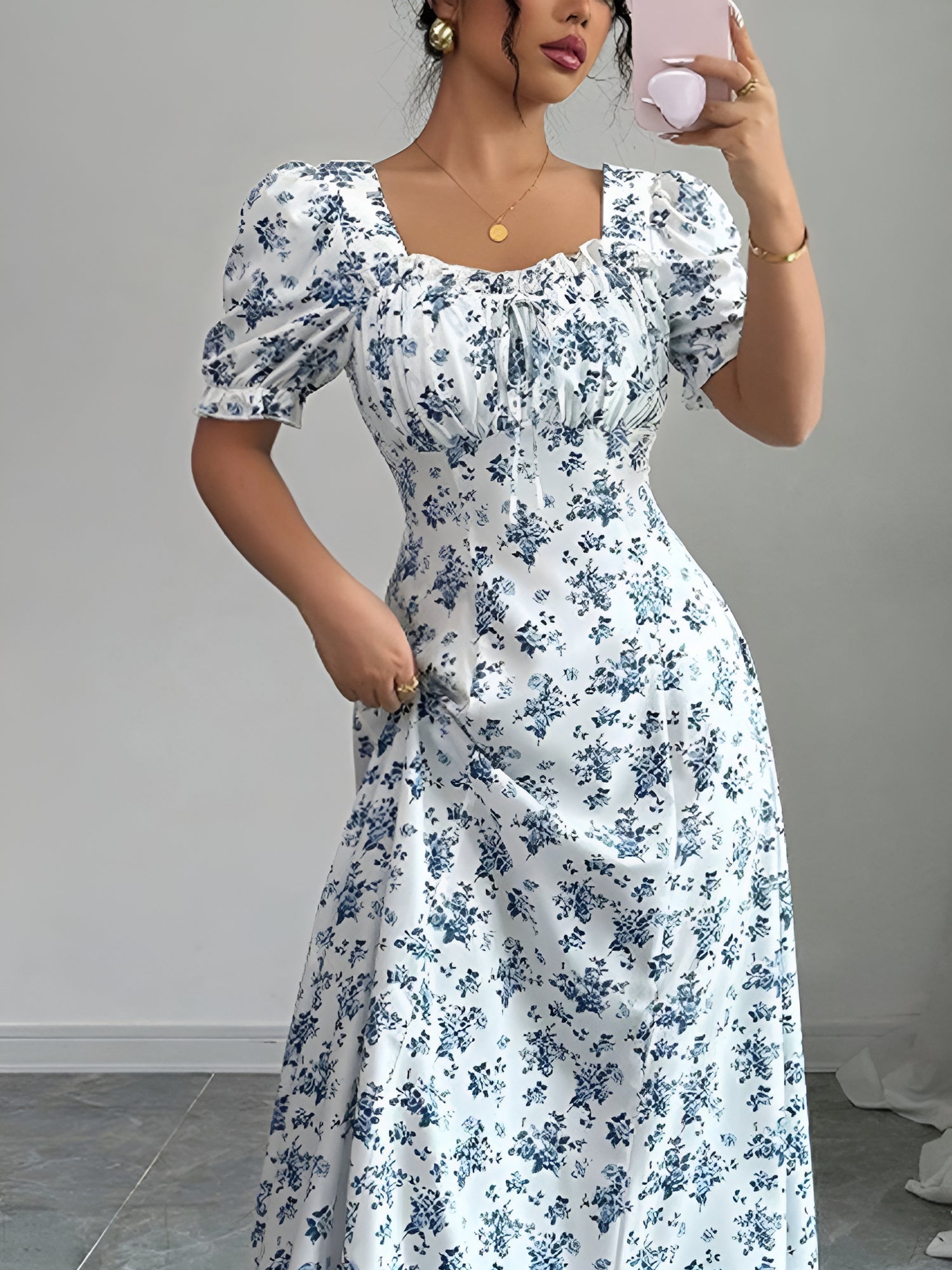 White - Woman wearing a floral print midaxi dress with puff sleeves, a square neckline, and a ruched bust detail.