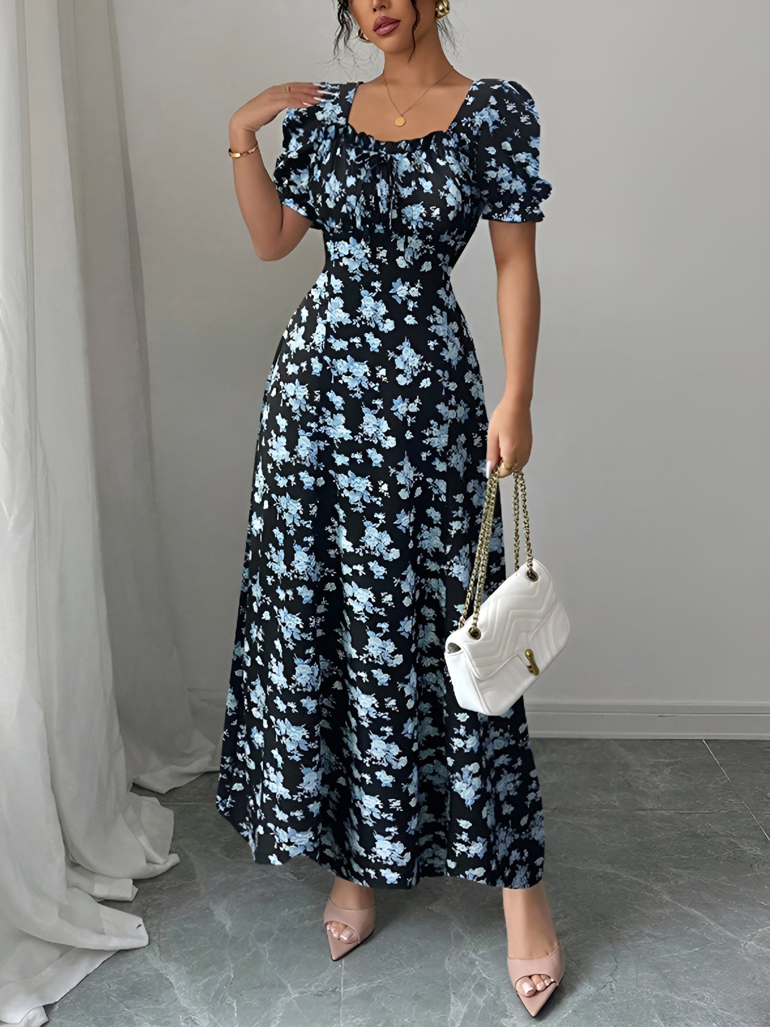 Blue - Woman wearing a floral print midaxi dress with puff sleeves, a square neckline, and a ruched bust detail.