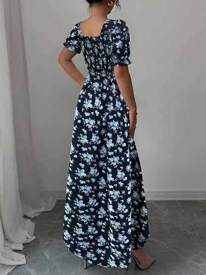 Blue - Woman wearing a floral print midaxi dress with puff sleeves, a square neckline, and a ruched bust detail.