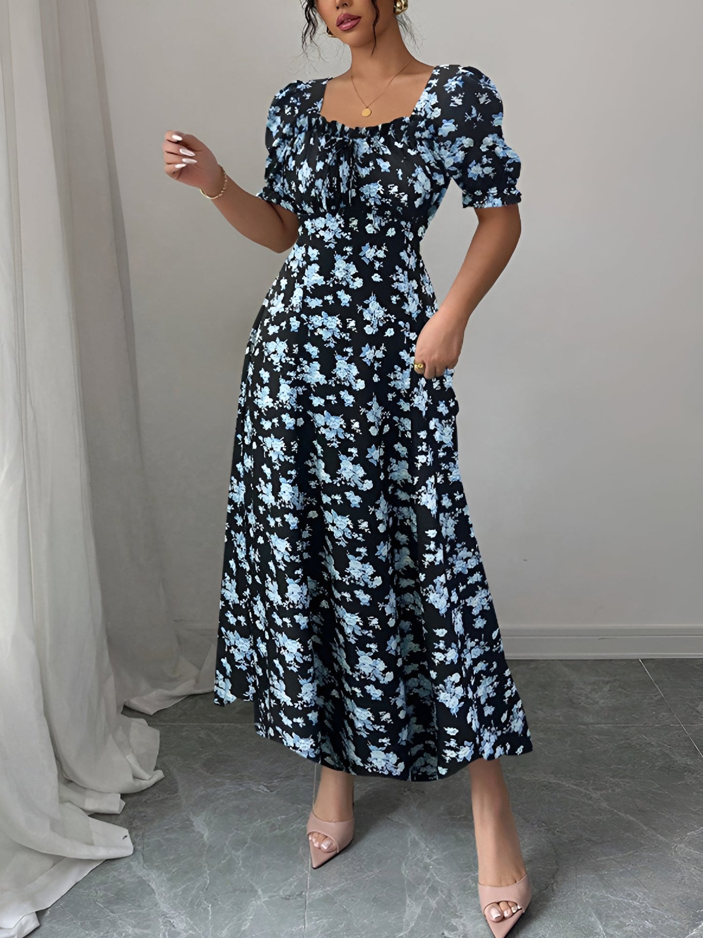 Blue - Woman wearing a floral print midaxi dress with puff sleeves, a square neckline, and a ruched bust detail.