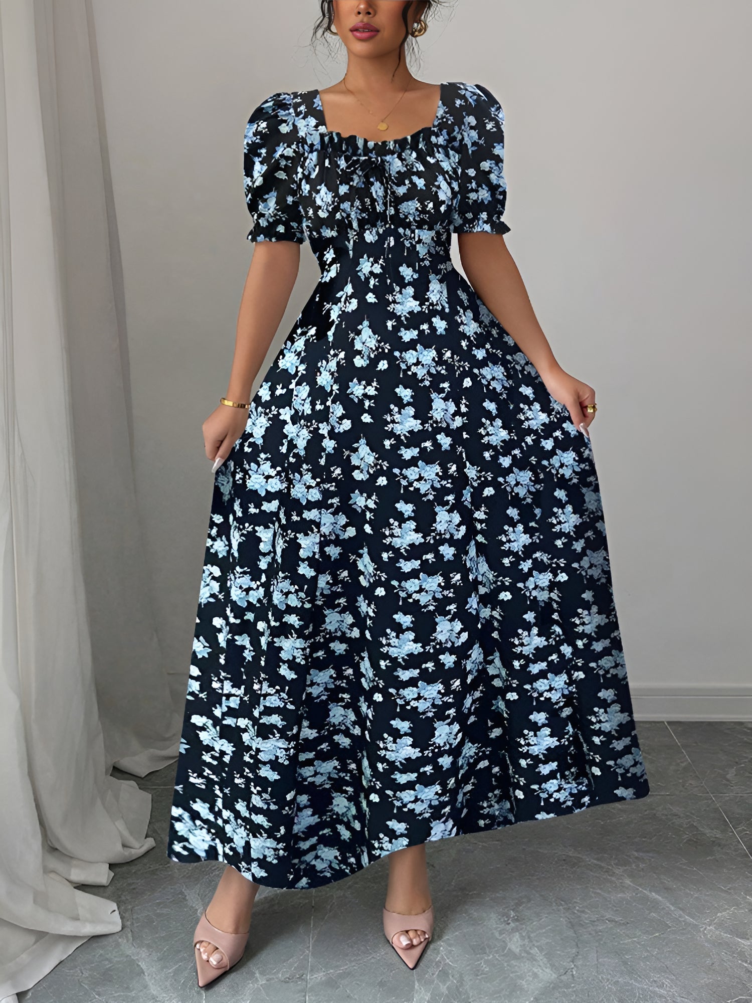 Blue - Woman wearing a floral print midaxi dress with puff sleeves, a square neckline, and a ruched bust detail.