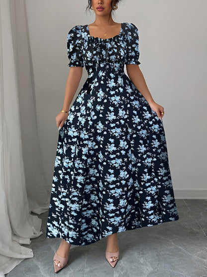 Blue - Woman wearing a floral print midaxi dress with puff sleeves, a square neckline, and a ruched bust detail.
