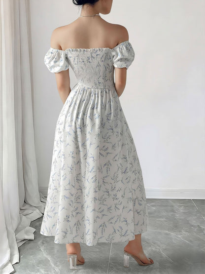 Blue - Woman wearing a woven floral square-neck midi dress with short puff sleeves and a shirred bodice