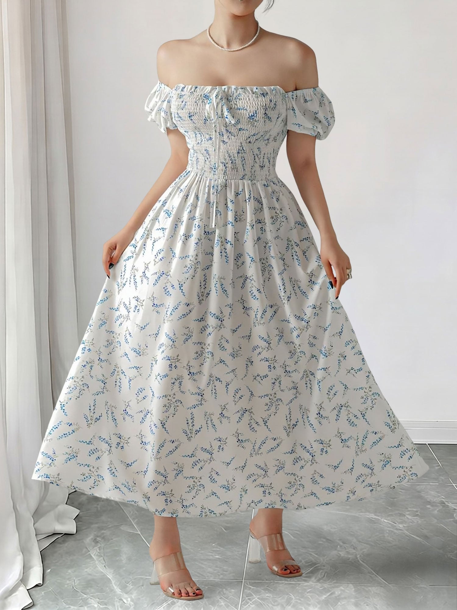 Blue - Woman wearing a woven floral square-neck midi dress with short puff sleeves and a shirred bodice