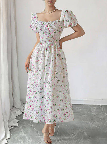 Pink - Woman wearing a woven floral square-neck midi dress with short puff sleeves and a shirred bodice