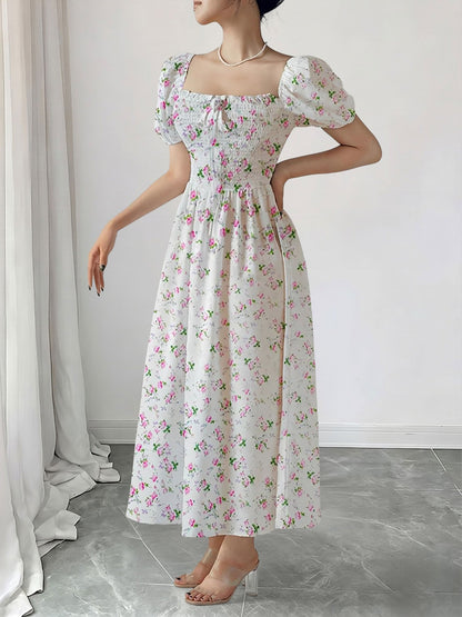 Pink - Woman wearing a woven floral square-neck midi dress with short puff sleeves and a shirred bodice