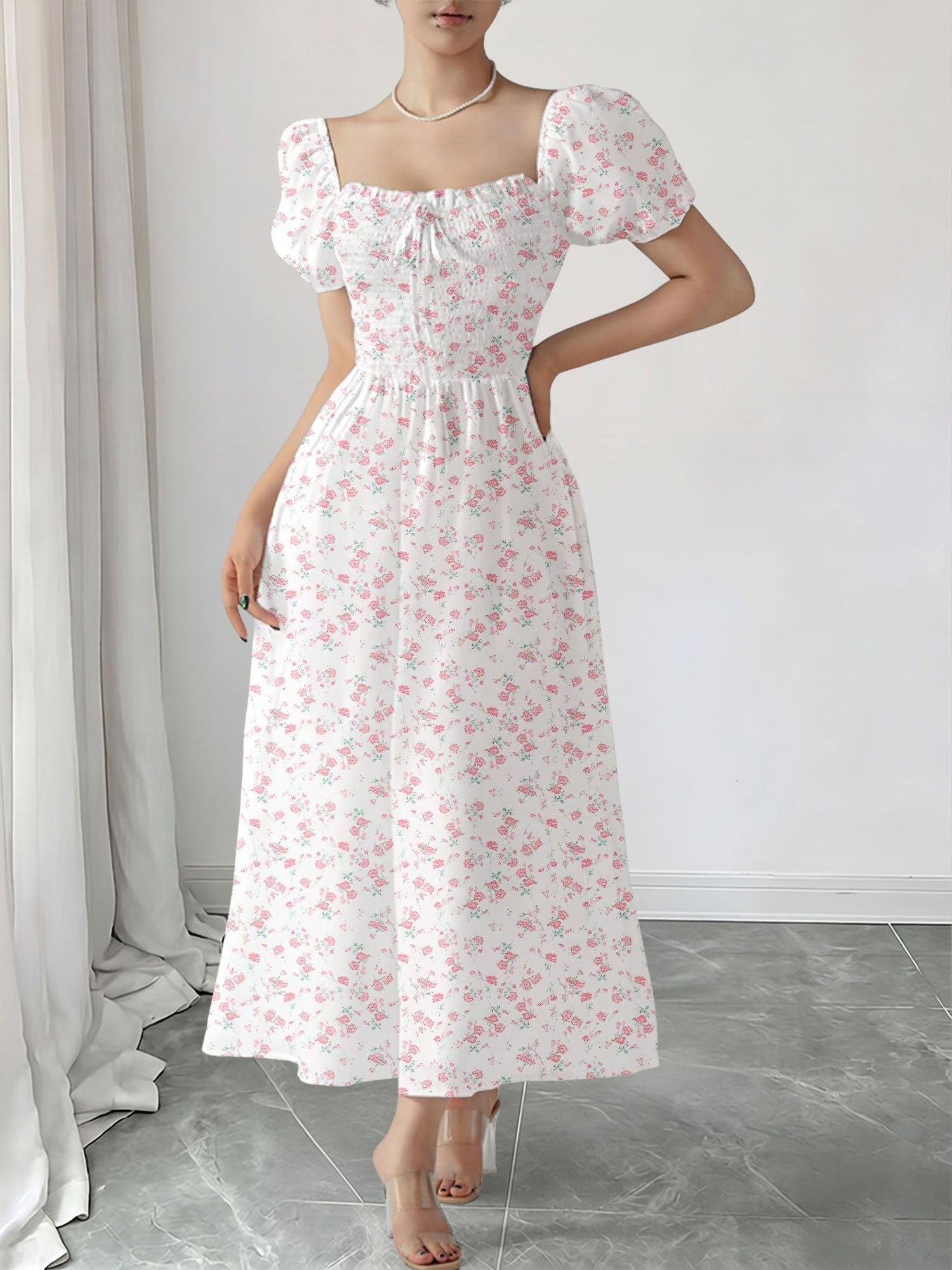 Light Pink - Woman wearing a woven floral square-neck midi dress with short puff sleeves and a shirred bodice