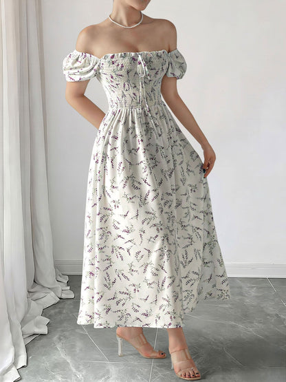 Purple - Woman wearing a woven floral square-neck midi dress with short puff sleeves and a shirred bodice