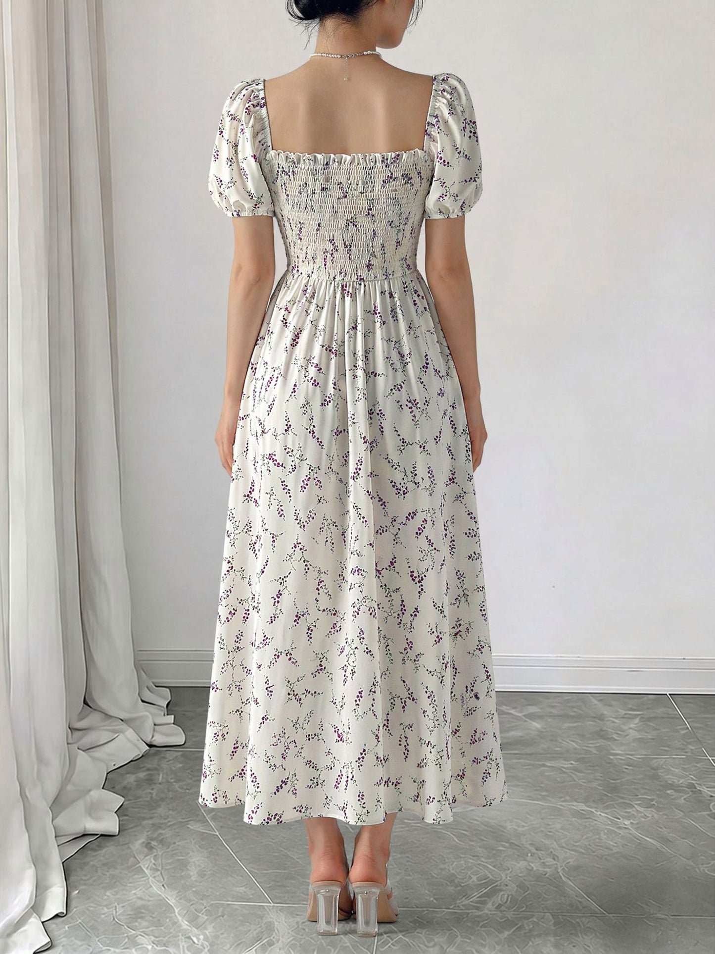 Purple - Woman wearing a woven floral square-neck midi dress with short puff sleeves and a shirred bodice