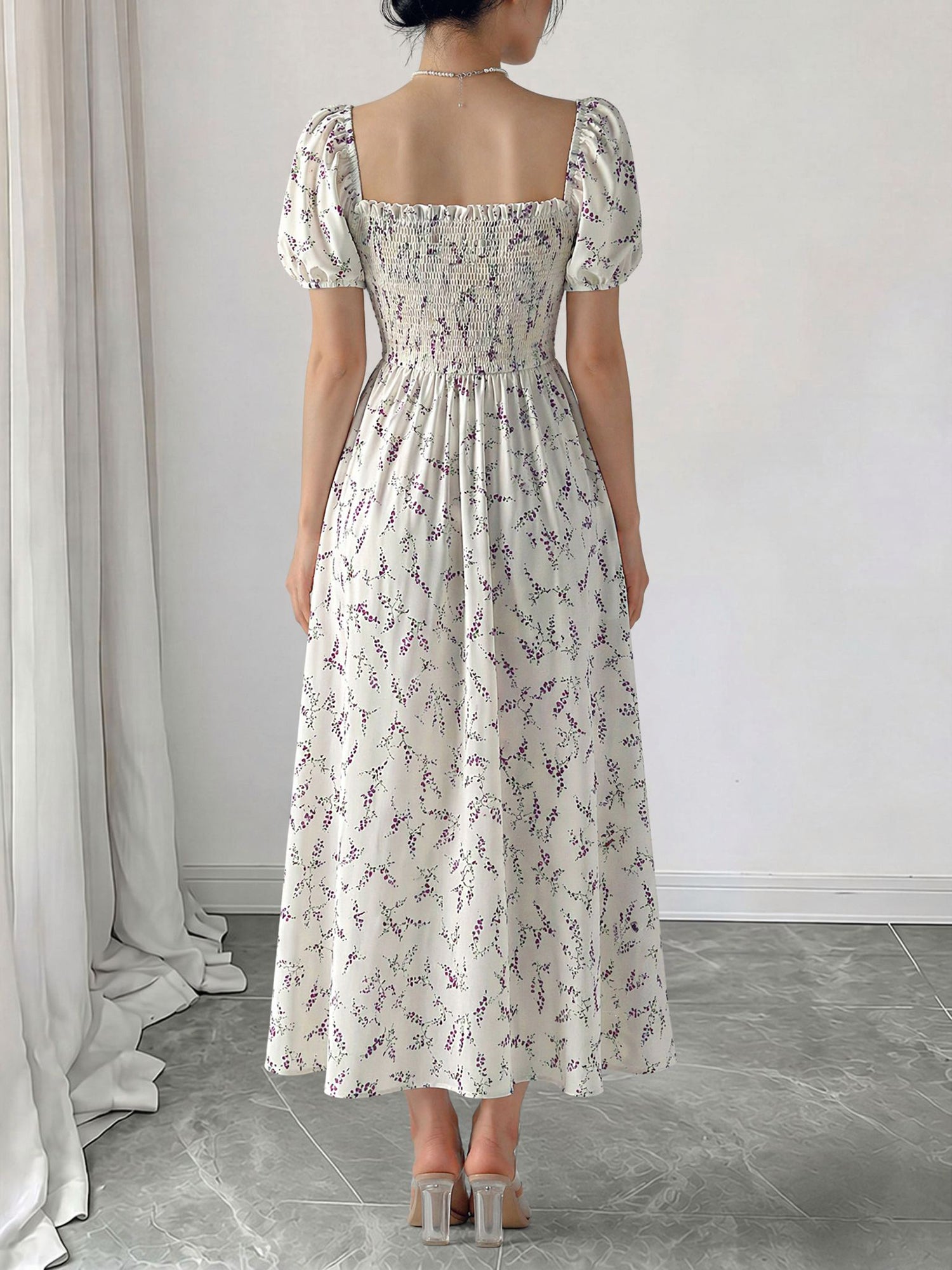 Purple - Woman wearing a woven floral square-neck midi dress with short puff sleeves and a shirred bodice