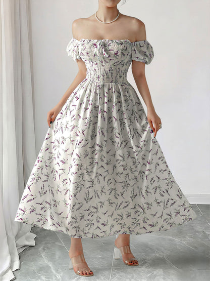 Purple - Woman wearing a woven floral square-neck midi dress with short puff sleeves and a shirred bodice