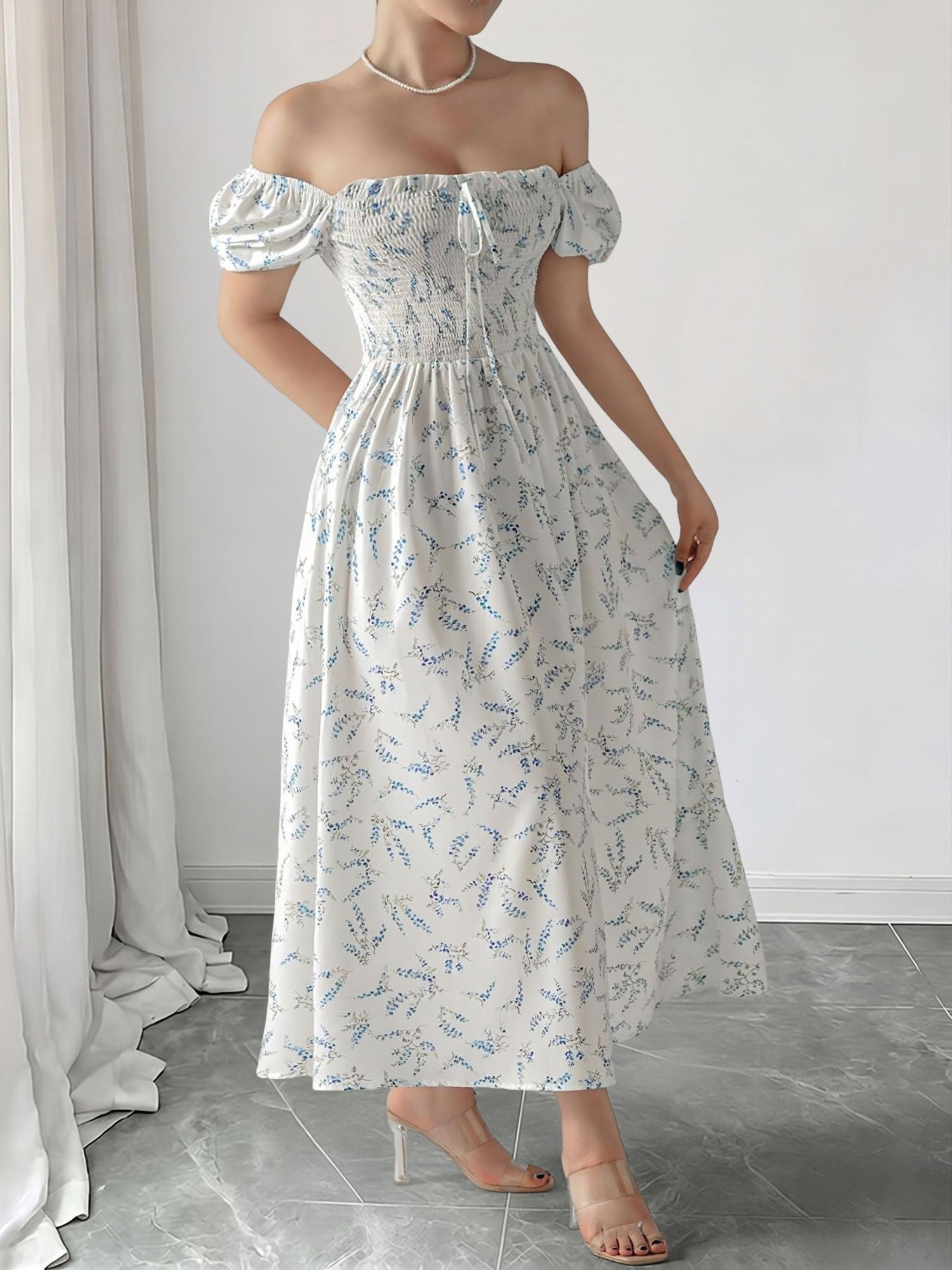 Blue - Woman wearing a woven floral square-neck midi dress with short puff sleeves and a shirred bodice