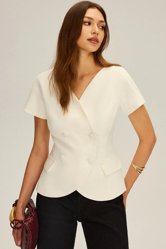 White - Women's tailored short-sleeve top featuring a double-breasted front, V-neckline, flap pockets, and a curved hem.