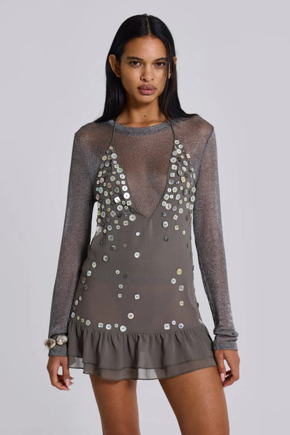 Grey - Women's grey halter neck mini dress featuring a deep plunging neckline, scattered button embellishments, an open back, and a tiered ruffle hem.