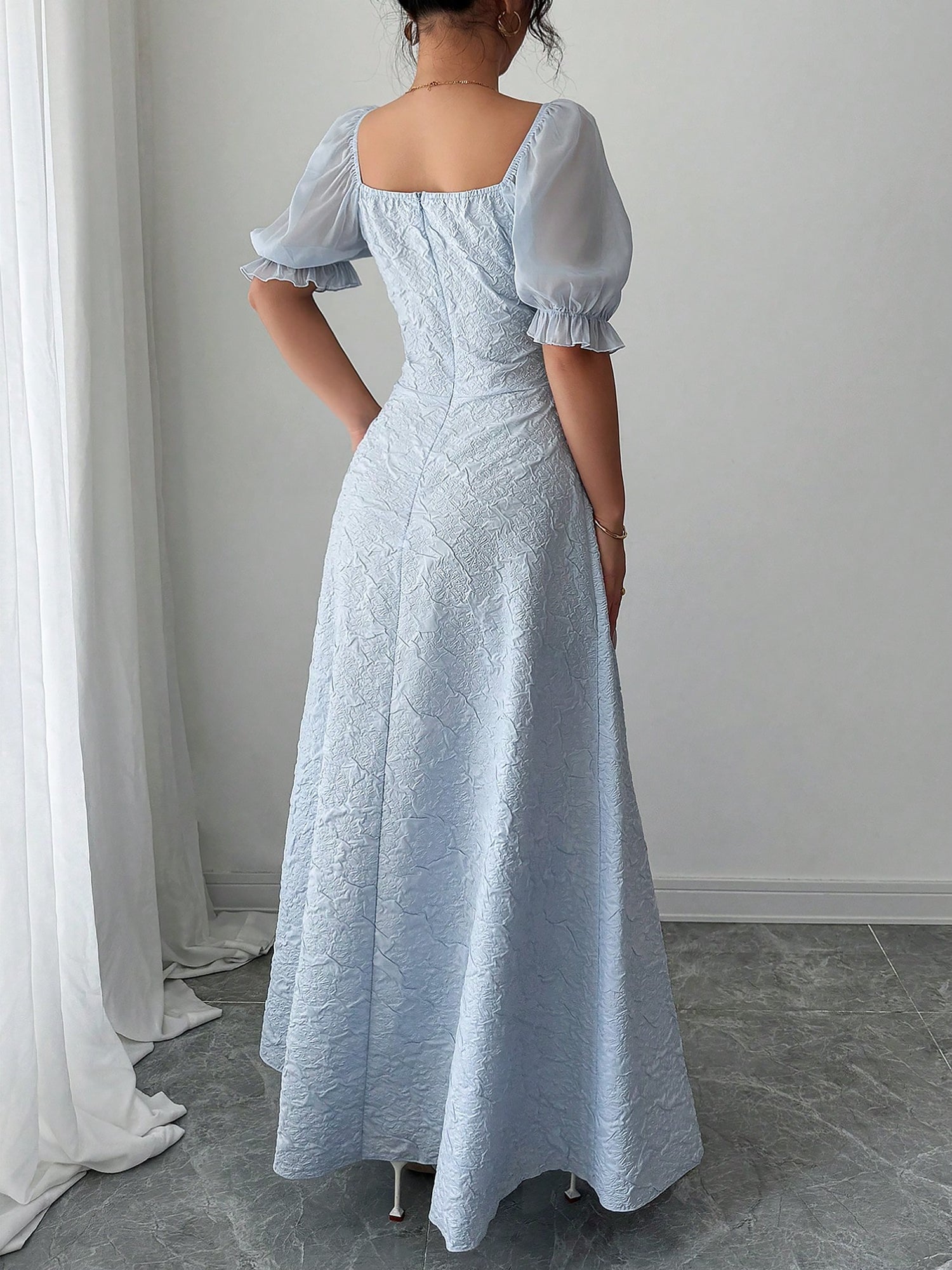 Grey Blue - Model wearing a textured jacquard A-line maxi dress with sheer puff sleeves and side lace-up bodice detailing.
