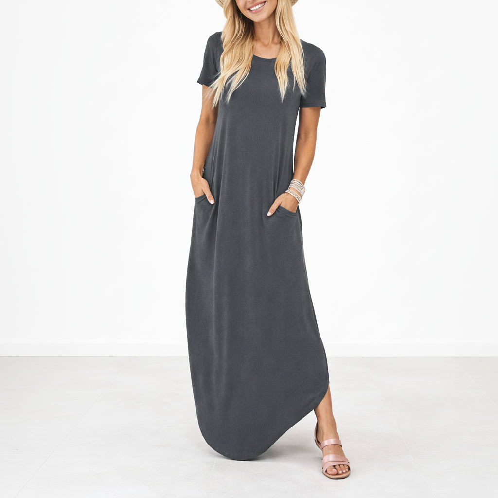 Grey - Model wearing a striped short-sleeve maxi dress with a round neckline, side pockets, and a subtle side split, styled with trainers and a straw hat.