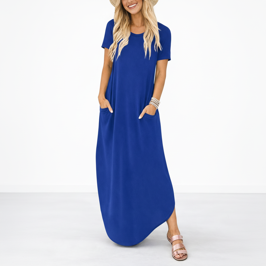 Navy Blue - Model wearing a striped short-sleeve maxi dress with a round neckline, side pockets, and a subtle side split, styled with trainers and a straw hat.