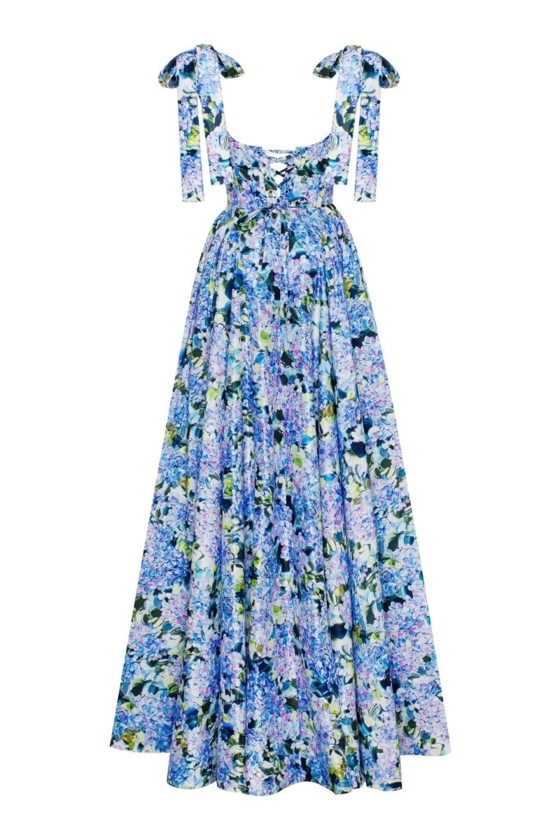 Blue - A woman models an elegant floor-length maxi dress featuring a structured corset bodice, tie-shoulder straps, and a vibrant blue and green floral print on a crisp, voluminous fabric.