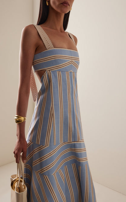 Women's light blue, beige, and brown striped midi dress featuring wide textured straps, side waist cutouts, and a panelled A-line skirt creating a chevron stripe effect.