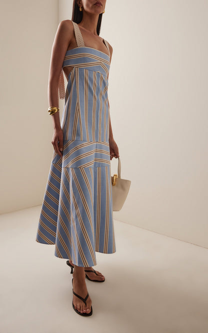Women's light blue, beige, and brown striped midi dress featuring wide textured straps, side waist cutouts, and a panelled A-line skirt creating a chevron stripe effect.