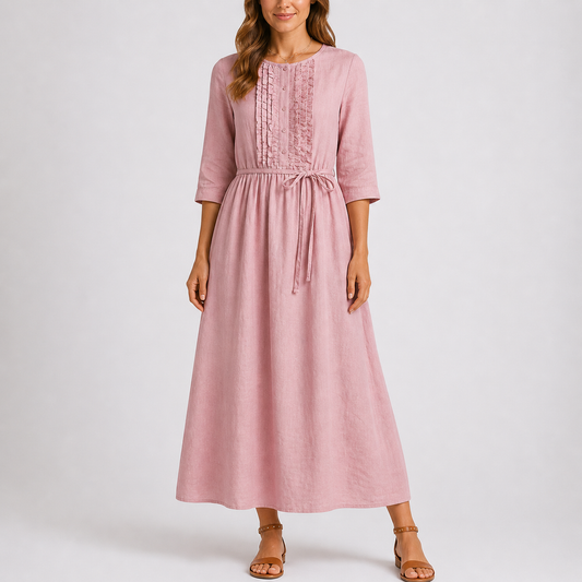 Pink - Woman wearing a relaxed woven midaxi dress with 3/4 sleeves, a tie waist, and a ruffled button-front bodice