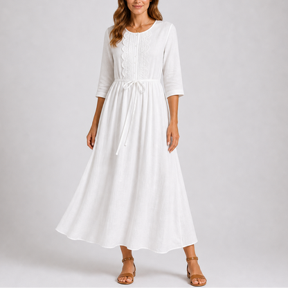 White - Woman wearing a relaxed woven midaxi dress with 3/4 sleeves, a tie waist, and a ruffled button-front bodice