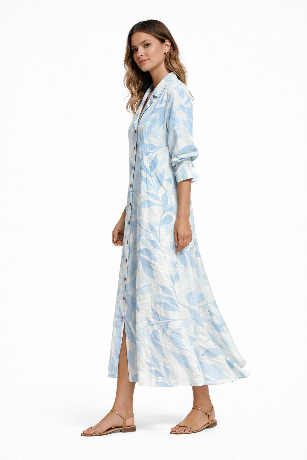 Light Blue Foral - Woman wearing a long, relaxed-fit botanical print shirt dress with 3/4 sleeves, a collared neckline, and button-down front.