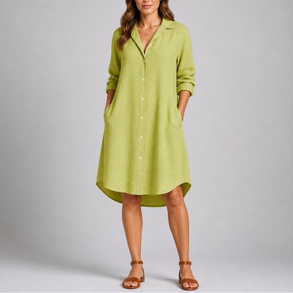 Green - Woman modelling a relaxed fit, long-sleeve midi shirt dress featuring a collared neckline, button-down front, and side pockets.