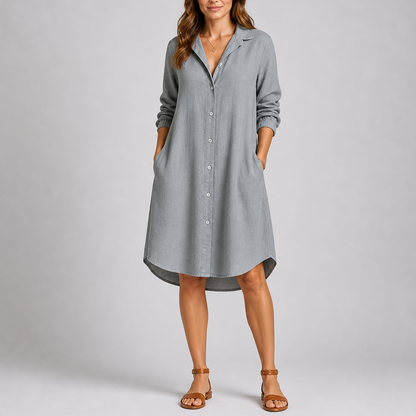 Grey - Woman modelling a relaxed fit, long-sleeve midi shirt dress featuring a collared neckline, button-down front, and side pockets.