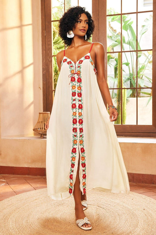 White - Women's cream maxi dress featuring delicate red spaghetti straps, a relaxed flowing silhouette, a vibrant central panel of red and orange floral embroidery, and a front slit.