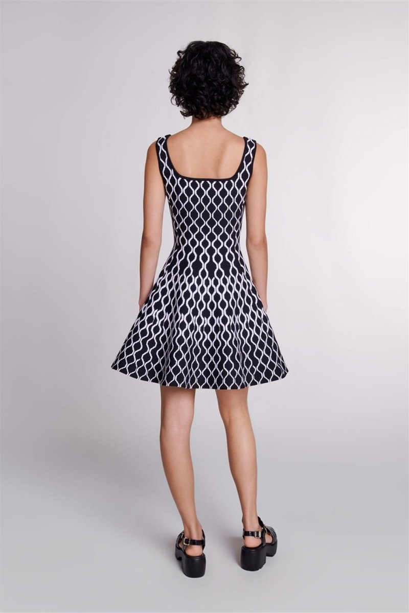 Black - Women's sleeveless fit-and-flare mini dress featuring a bold black and white geometric print, a square neckline, and side pockets.