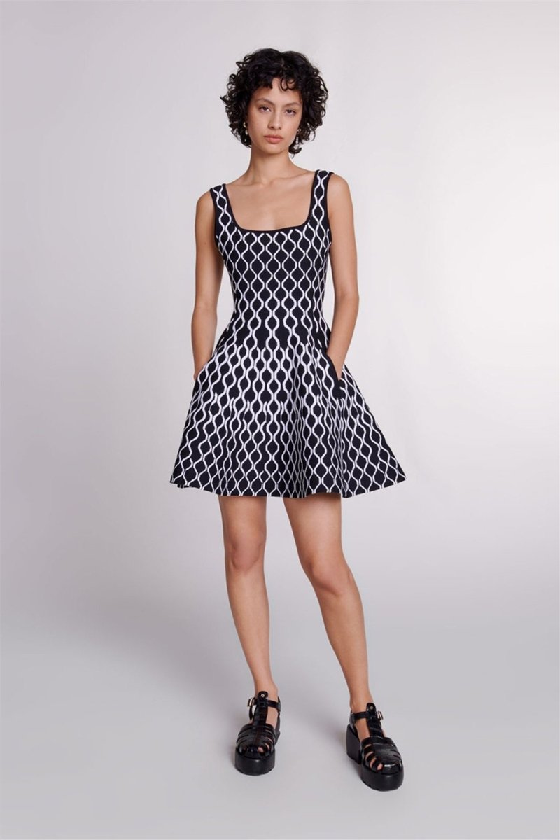 Black - Women's sleeveless fit-and-flare mini dress featuring a bold black and white geometric print, a square neckline, and side pockets.