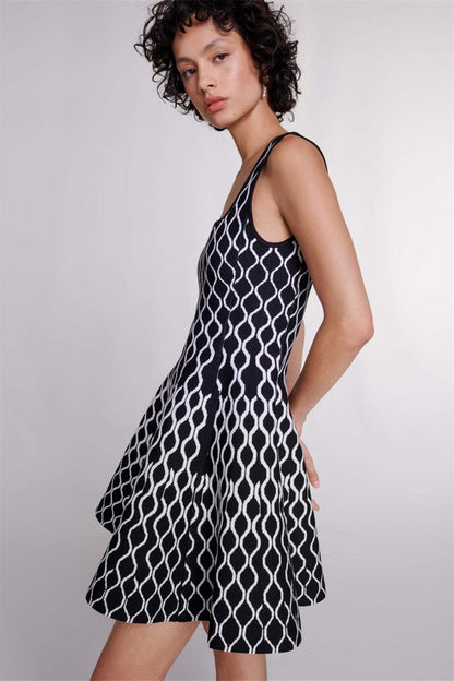 Black - Women's sleeveless fit-and-flare mini dress featuring a bold black and white geometric print, a square neckline, and side pockets.