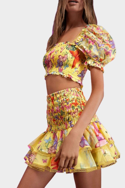 Yellow - Women's white cropped blouse featuring a colourful butterfly and botanical print, a shirred bodice, square neckline, and short puff sleeves, paired with a matching tiered mini skirt.