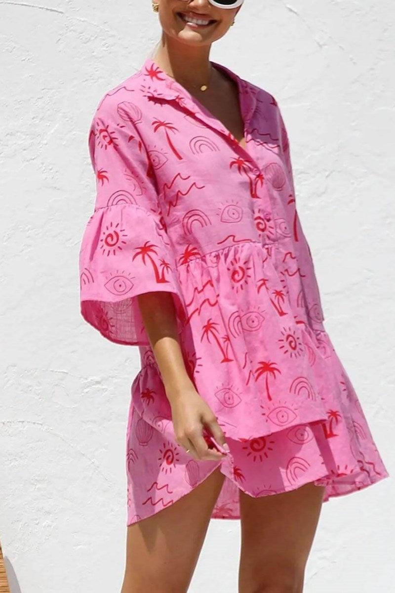 Pink - Women's light-coloured mini dress featuring a blue line-art print of suns and vases, styled with a V-neck collar, button front, wide half sleeves, and a voluminous tiered smock silhouette.