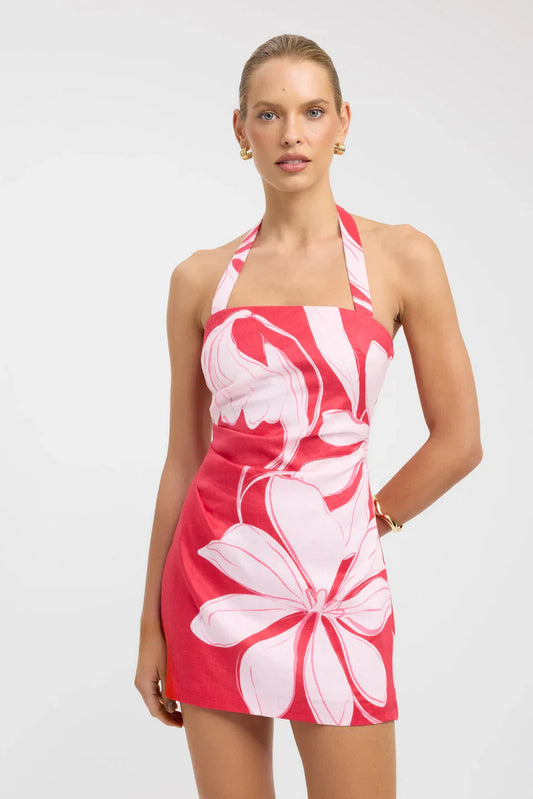 Women's tailored mini dress featuring a bold pink and red large-scale floral print, a straight neckline with wide halter straps, and subtle waist gathering.