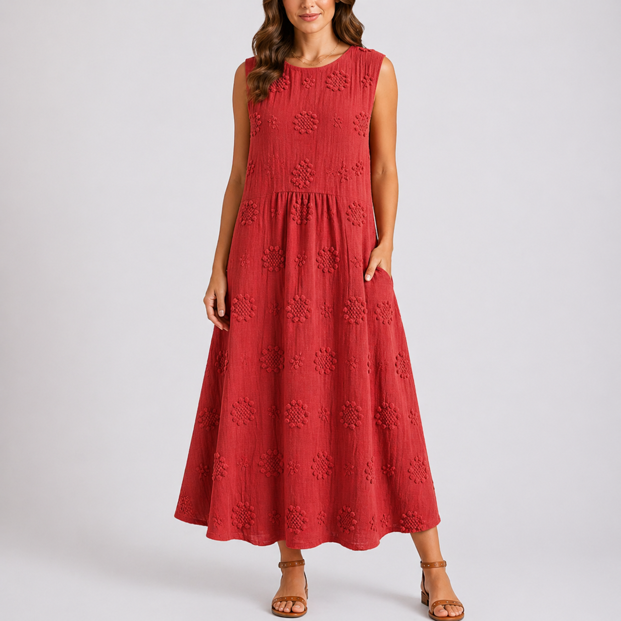 Red - Sleeveless midaxi smock dress featuring tufted floral patterns, a round neckline, and side pockets, styled on a model against a plain background.