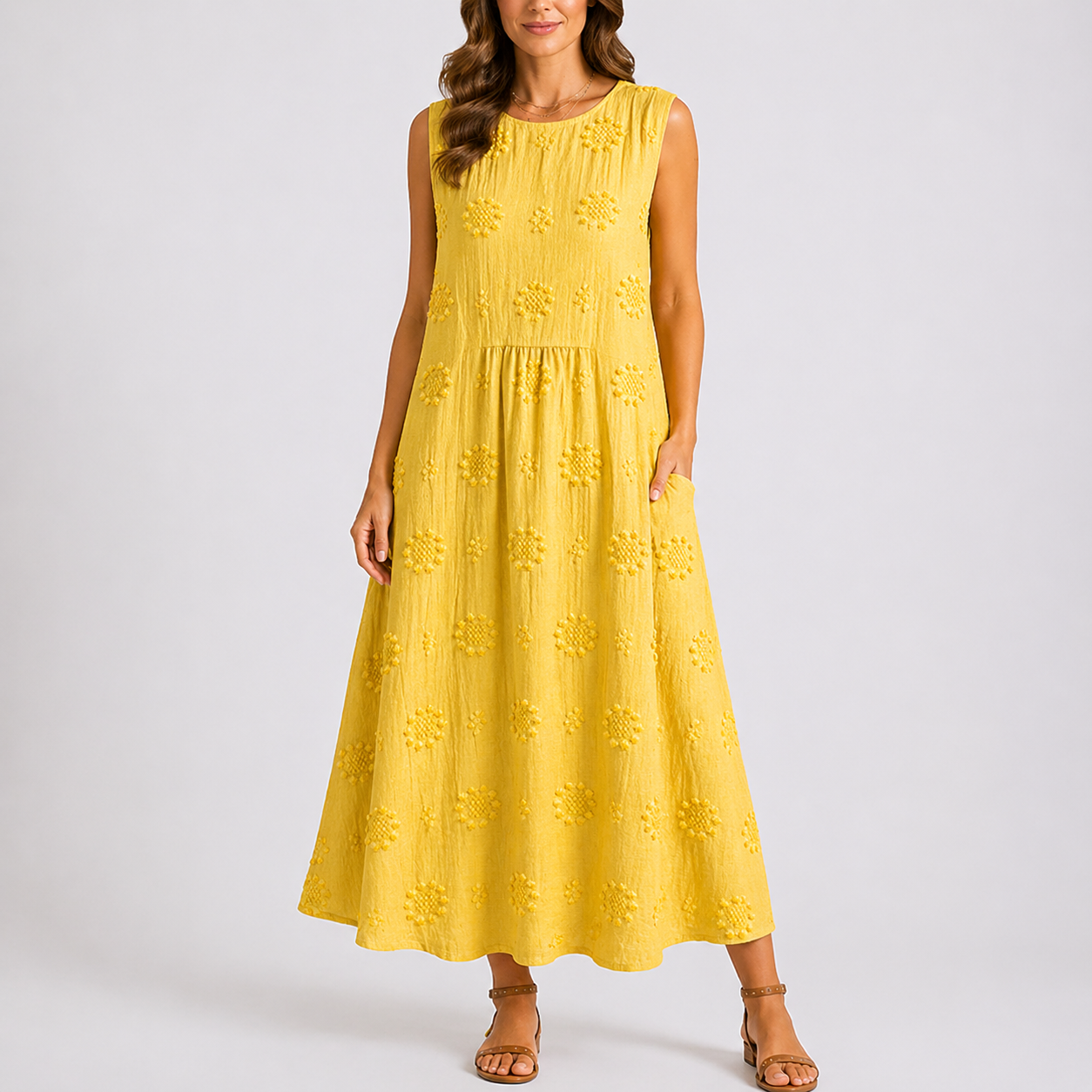 Yellow - Sleeveless midaxi smock dress featuring tufted floral patterns, a round neckline, and side pockets, styled on a model against a plain background.